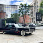 STK Steakhouse sign and car in front of our Hotel, Westminster Curio Hilton