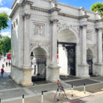 Marble Arch Memorial, at the North end of Park Lane, London. Originally a ceremonial entrance from the Mall to Buckingham Palace, moved to current position in 1851. Designed by John Nash and based on the triumphal Arch of Constantine in Rome.